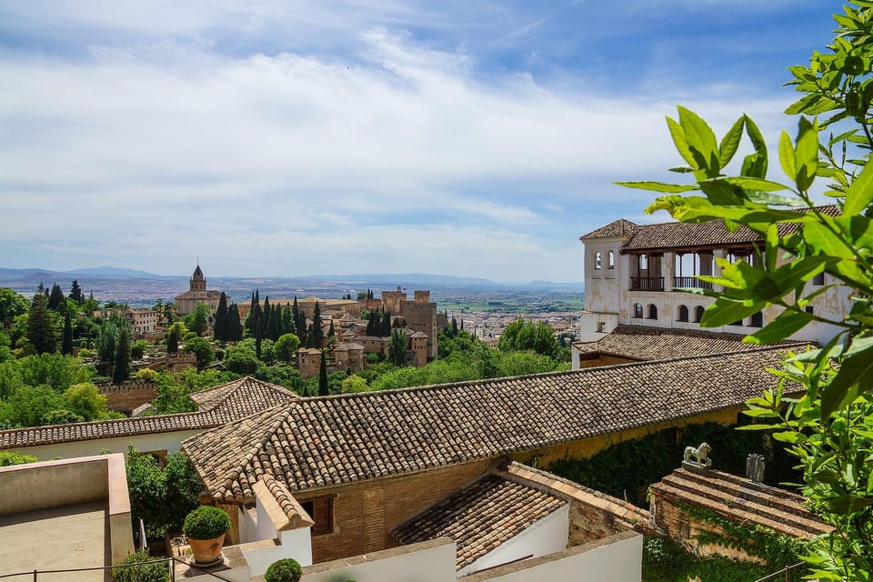 From Málaga: Sunset Alhambra Tour with Tickets - Generalife and Partal Gardens: the sunset mood switch you came for